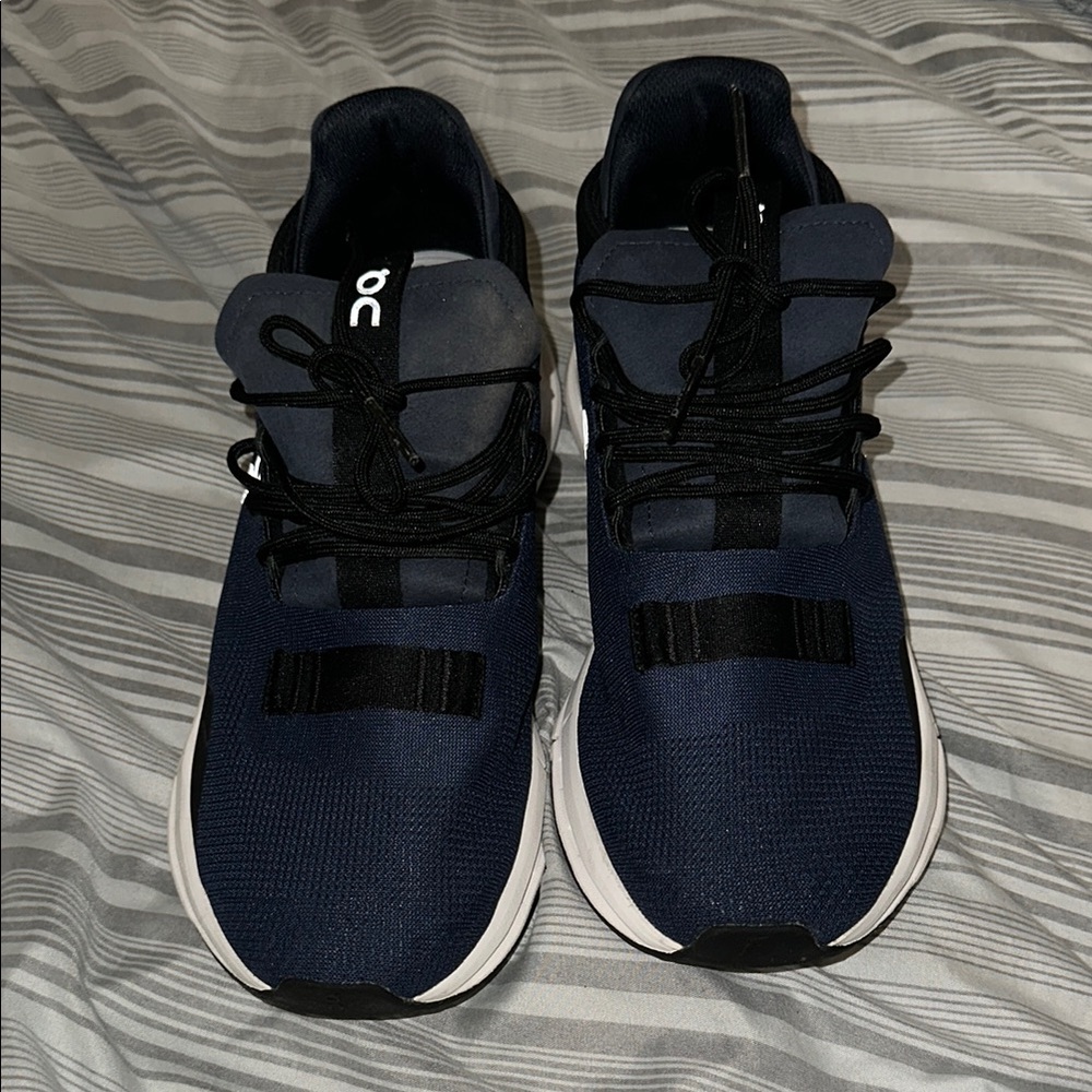 On Blue and Black Athletic Shoes with Modern Design Swiss Engineering Cloudtec